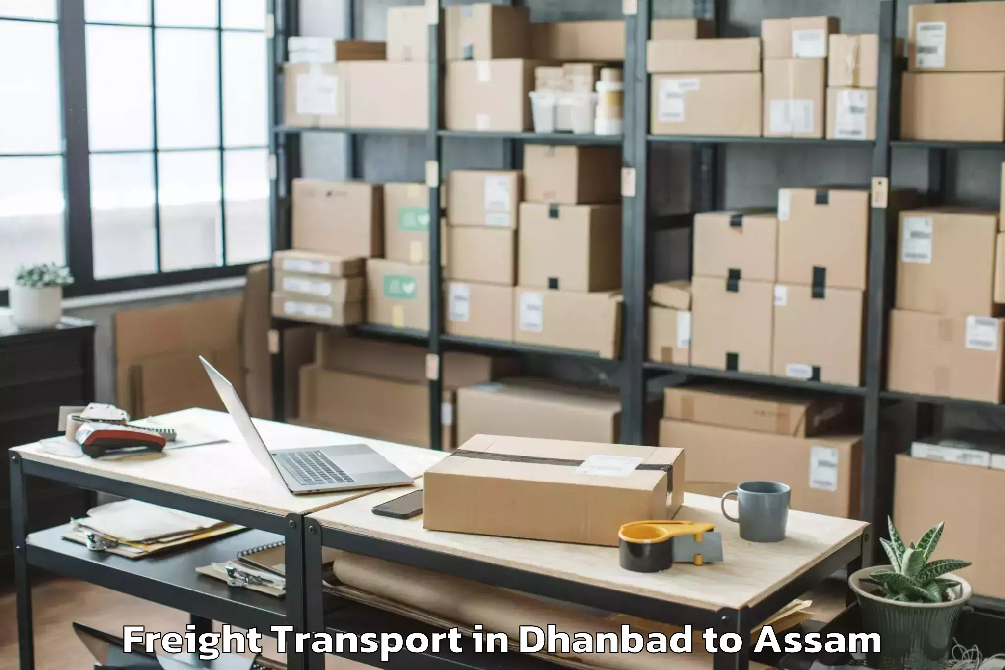 Book Dhanbad to Sualkuchi Freight Transport